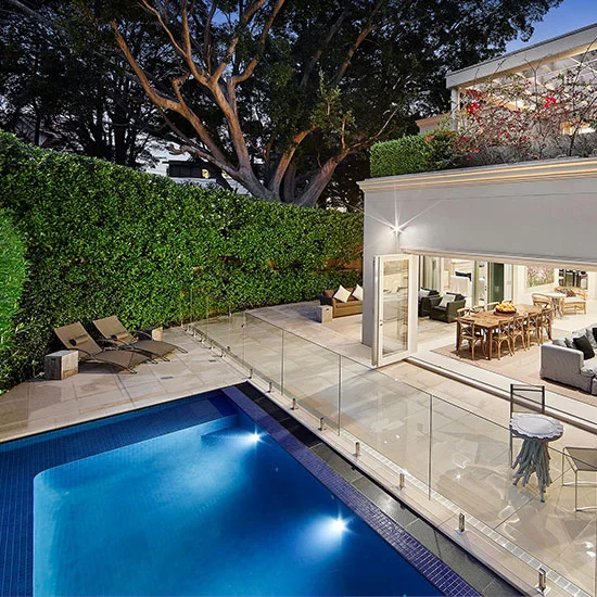 A picture of sandstone pavers around a pool in Melbourne.