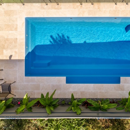 ivory travertine premium tiles around pool