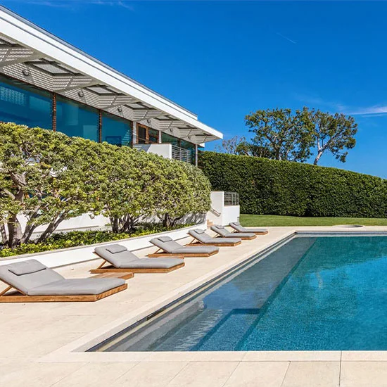 A picture of sandstone pavers around a pool in Melbourne.