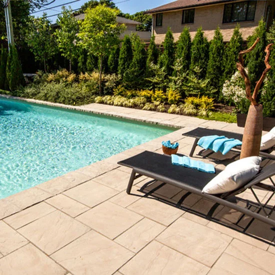 A picture of sandstone pavers around a pool in Melbourne.