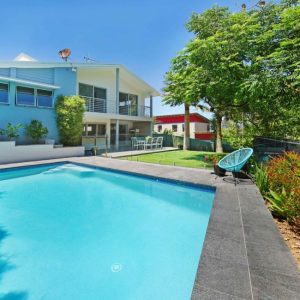 A picture of Black Granite pavers around a pool in Melbourne.