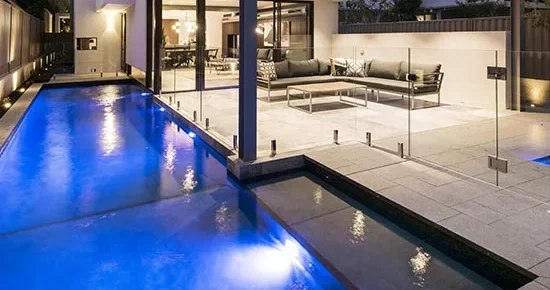 A picture of granite pavers around a pool in Melbourne.