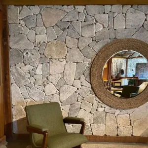 A picture of silver travertine crazy paving as a feature wall in Melbourne.