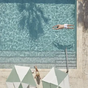 A picture of travertine crazy paving around a pool in Melbourne.